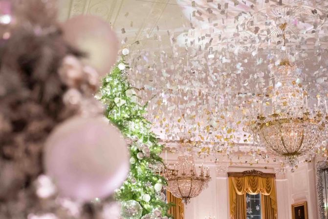 In the East Room, a reflective canopy wraps the ceiling and windows.