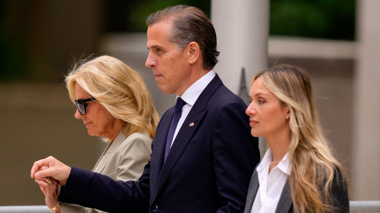 Hunter Biden, accompanied by first lady Jill Biden, left, and his wife, Melissa Cohen Biden, right, walks out of federal court after hearing the verdict, Tuesday, June 11, in Wilmington, Delaware.