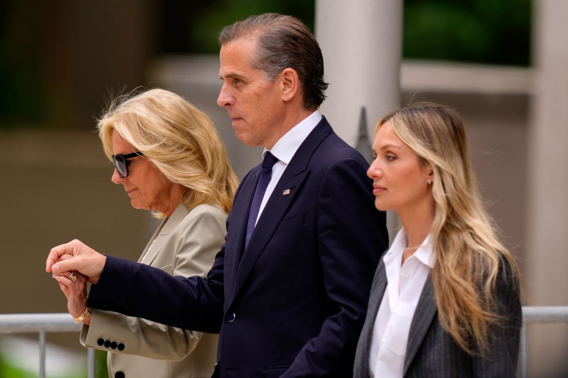 Hunter Biden, accompanied by first lady Jill Biden, left, and his wife, Melissa Cohen Biden, right, walks out of federal court after hearing the verdict, Tuesday, June 11, in Wilmington, Delaware.