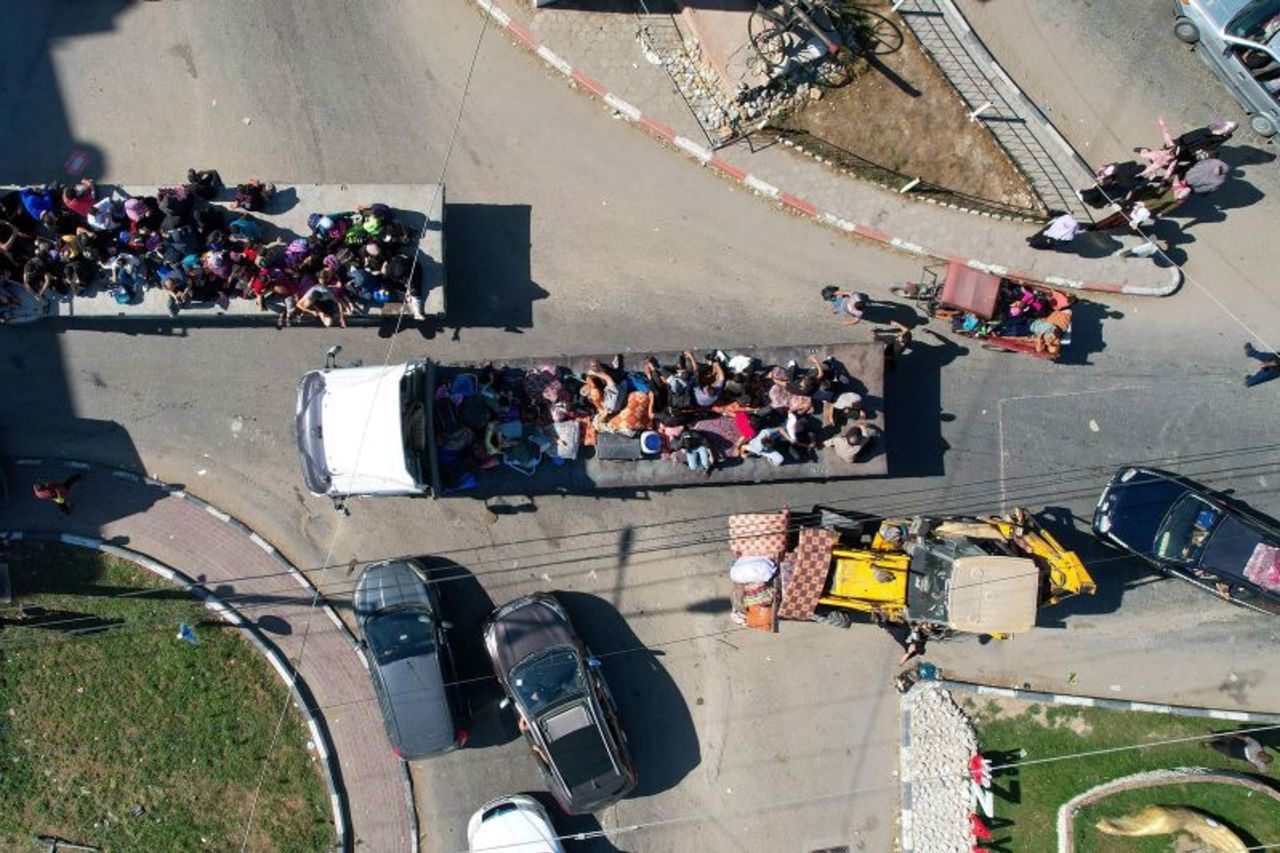 Palestinians flee from northern Gaza to the south after the Israeli army issued an unprecedented evacuation warning on Friday, October 13, 2023. 