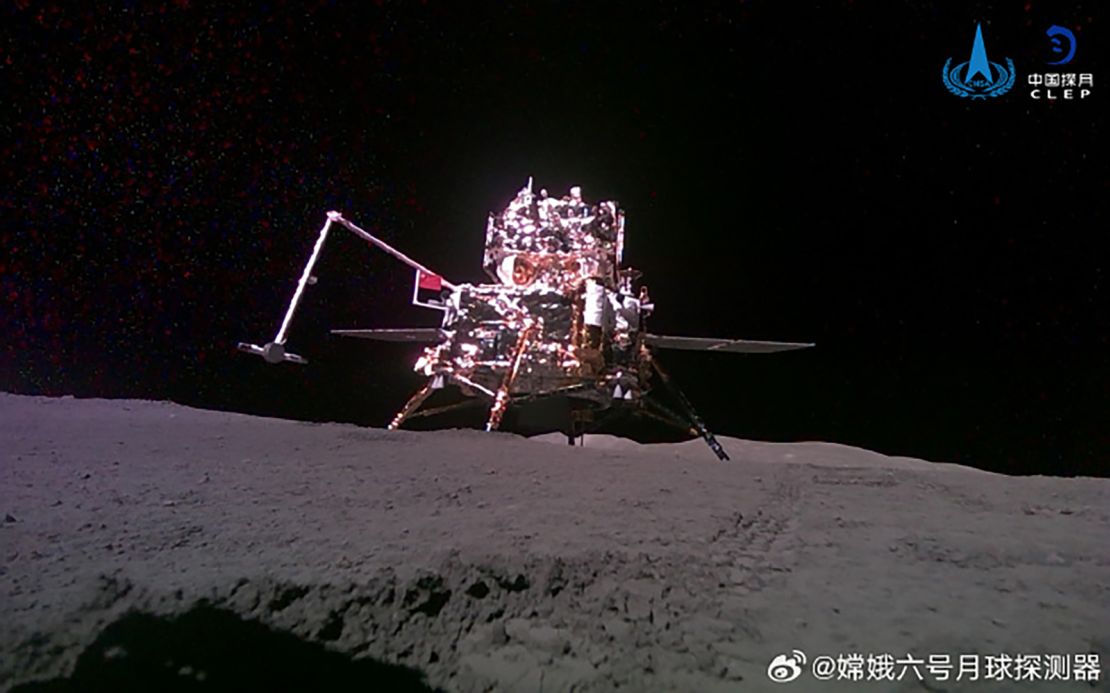 The Chang’e-6 probe is seen raising a Chinese flag with a robotic arm on the moon’s far side earlier in June.