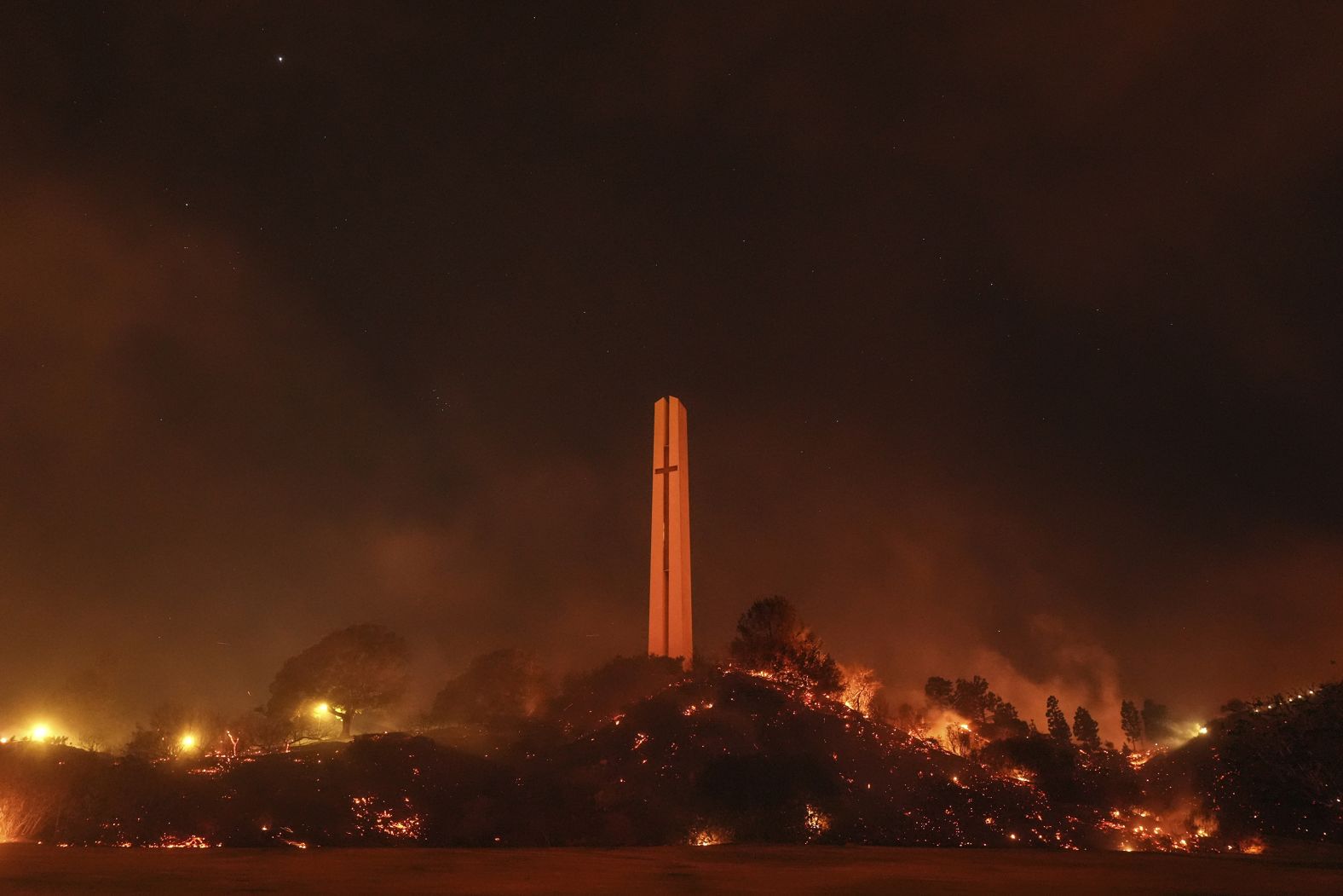 Vegetation is scorched Tuesday around the Phillips Theme Tower at Pepperdine University.