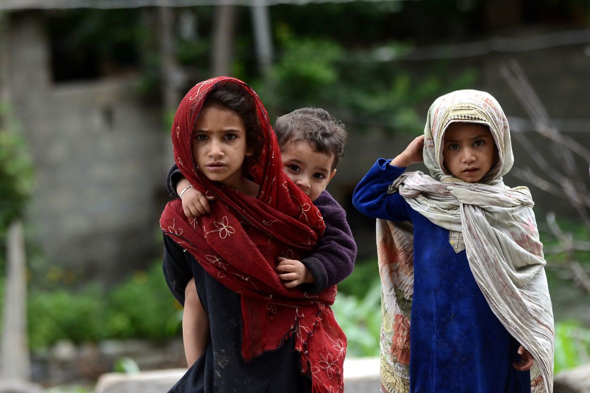Villagers are seen after flash floods and torrential rain tore through Gilgit-Baltistan, Pakistan, on July 25.