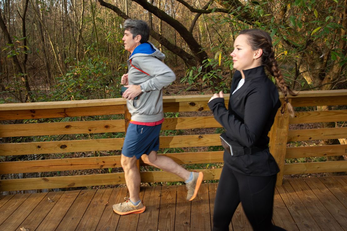 Madeline Holcombe runs with David in Piedmont Park.