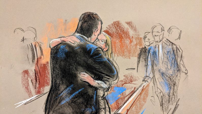 Hillary Clinton campaign lawyer Michael Sussmann is hugged after a jury acquitted him of lying to the FBI on May 31, 2022.