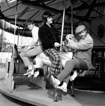 The Beach Boys pose on a carousel in Santa Monica, California, in 1966. From left are Bruce Johnston, Brian Wilson and Mike Love.