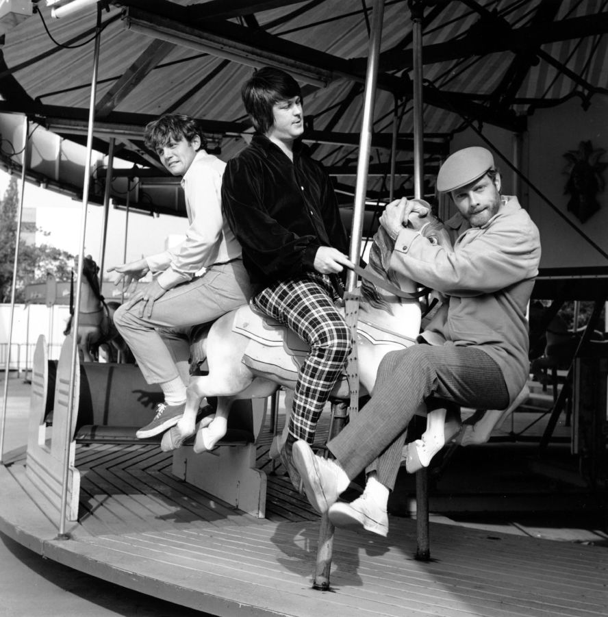 The Beach Boys pose on a carousel in Santa Monica, California, in 1966. From left are Bruce Johnston, Brian Wilson and Mike Love.