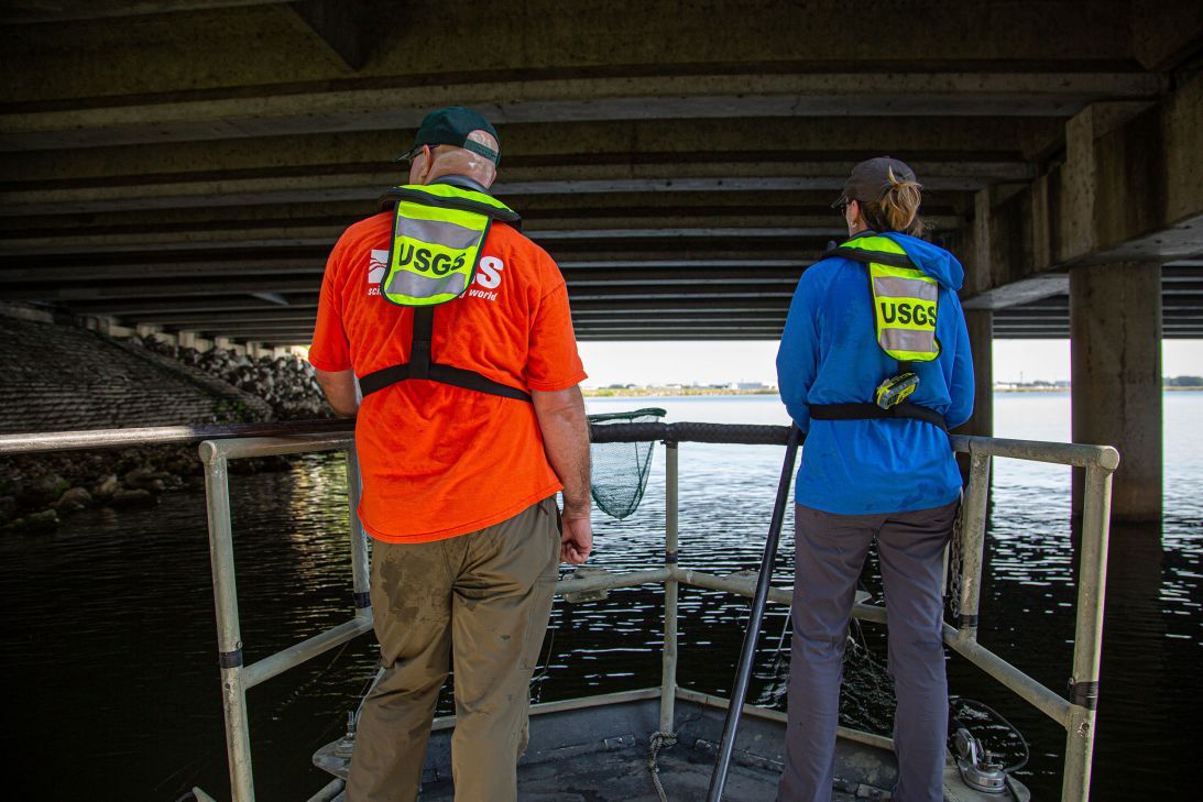 Daniel and Brown seek refuge from the summer heat underneath a bridge on Lake Underhill Park during their “eel slam."