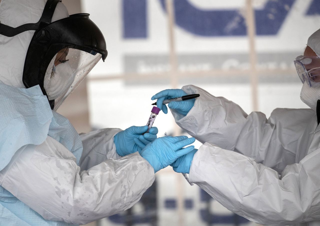 Health workers at a drive-through testing station in Stamford, Connecticut on March 23.