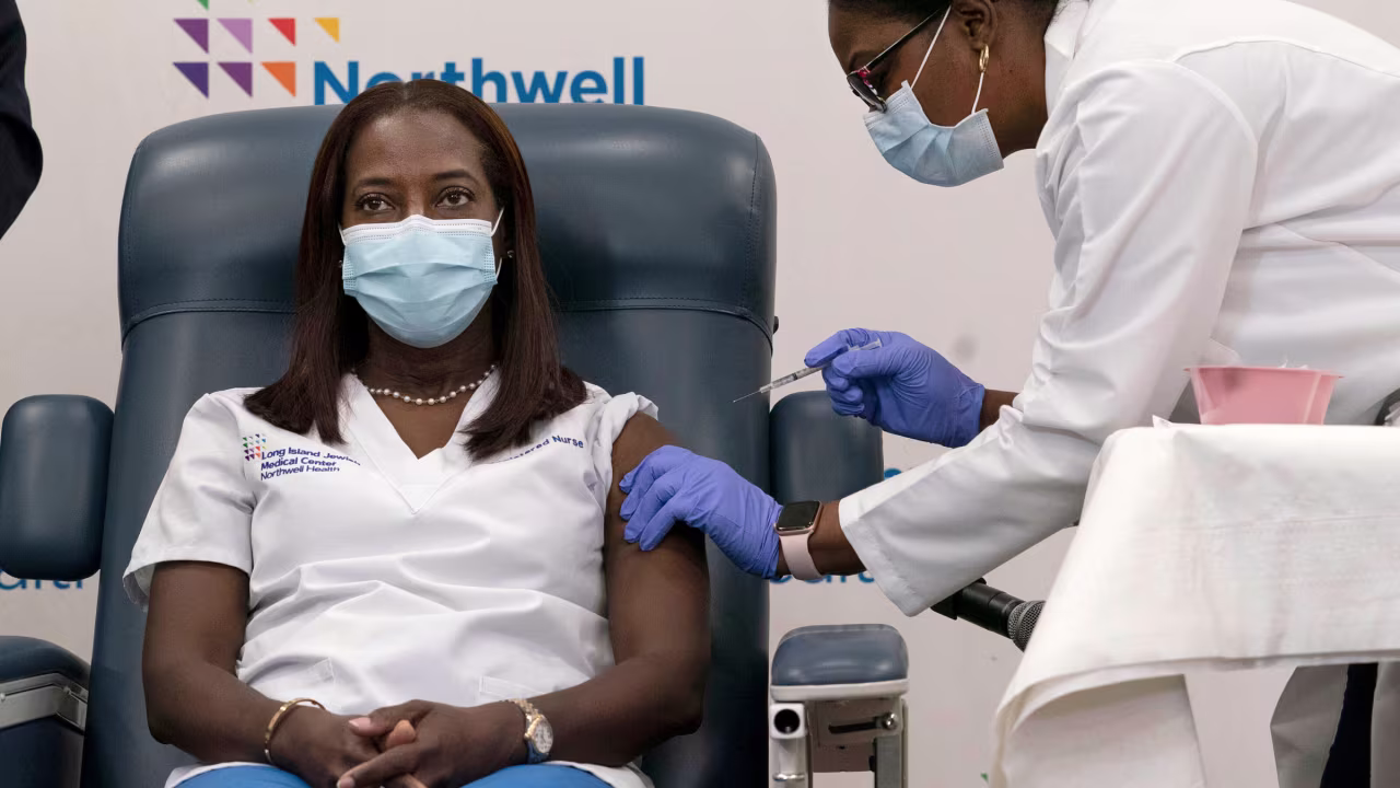 Sandra Lindsay receives the Pfizer Covid-19 vaccine from Dr. Michelle Chester in December 2020.