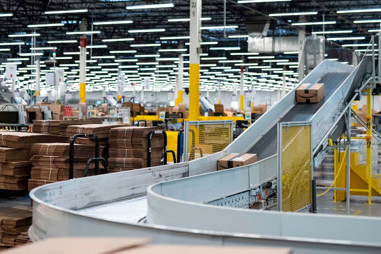 Packages move along a conveyer belt inside Amazon's fulfillment center in Kent, Washington, in 2018.