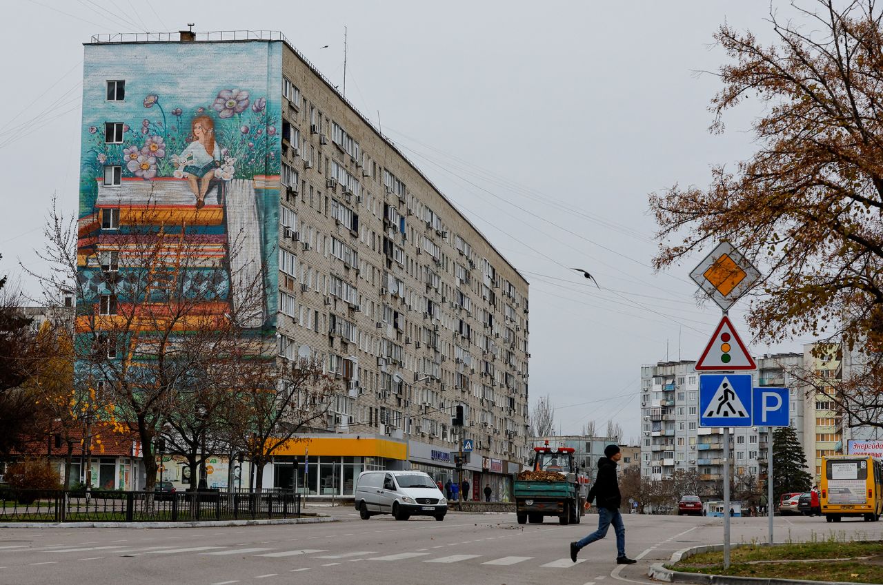A pedestrian crosses a street in the city of?Enerhodar?in the Zaporizhzhia region, Russian-controlled Ukraine, on November 24.