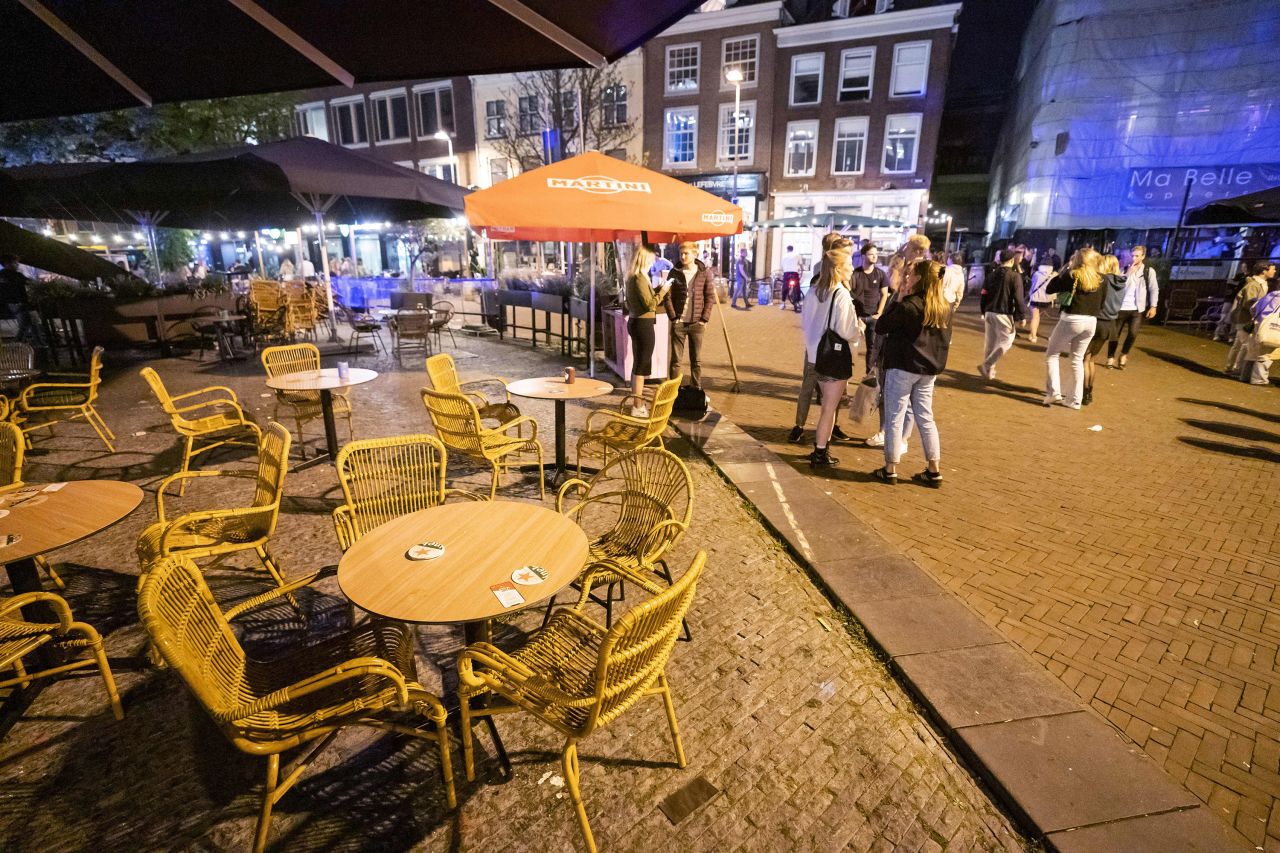 People leave cafes and restaurants at midnight on July 10, at the start of the newly implemented curfew in Netherlands. 