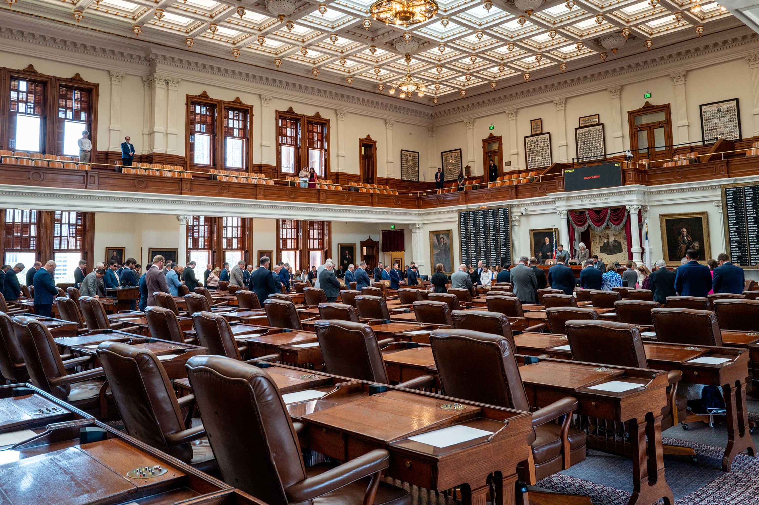 Empty seats are seen as a Texas House meeting is called to order at the state Capitol in Austin, Texas, on Tuesday, August 5. Texas Democratic lawmakers fled the state to protest a proposed Republican redistricting plan.