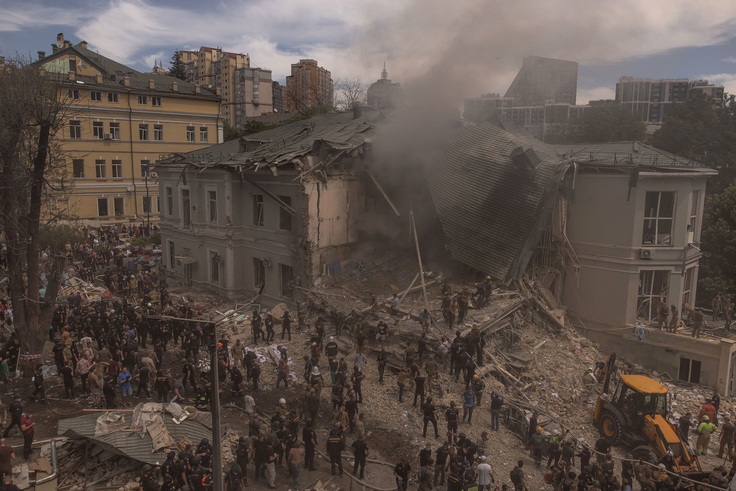 Emergency and rescue personnel clear rubble at the Okhmatdyt children’s hospital in Kyiv, Ukraine, on Monday, July 8.