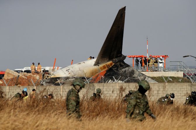 South Korean soldiers work near the wreckage of a passenger plane that crashed at Muan International Airport in Muan, South Korea, on December 29.