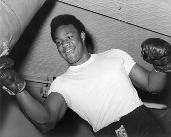 A young Foreman strikes a heavy bag in this undated photo. Foreman grew up as one of seven children in the troubled Fifth Ward in Houston. He joined the Job Corps when he was 16, doing construction work and forestry — and it was there that he met Job Corps counsellor and boxing coach Doc Broaddus.