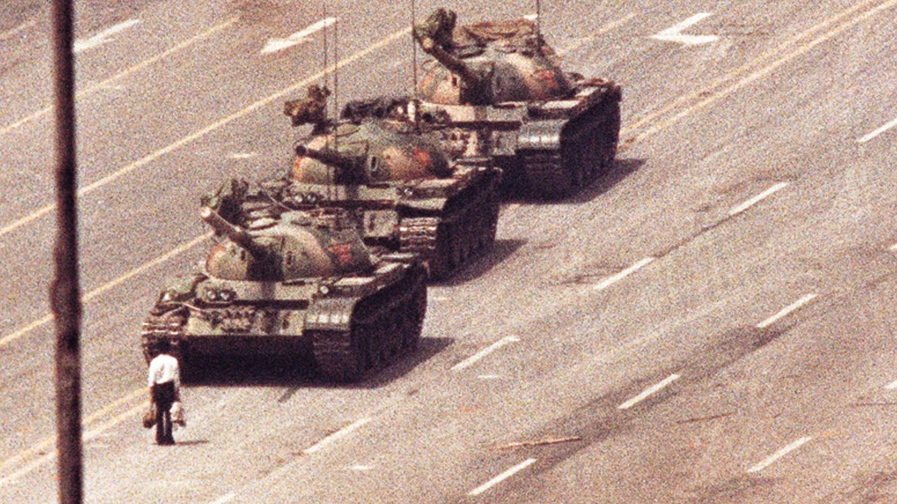 A man stands in front of a convoy of tanks in Beijing’s Tiananmen Square on June 5, 1989. It was a day after Chinese troops began violently cracking down on pro-democracy demonstrators who had been in the square for over a month. The man was eventually pulled away by onlookers. To this day, we don’t know who he is and what happened to him.