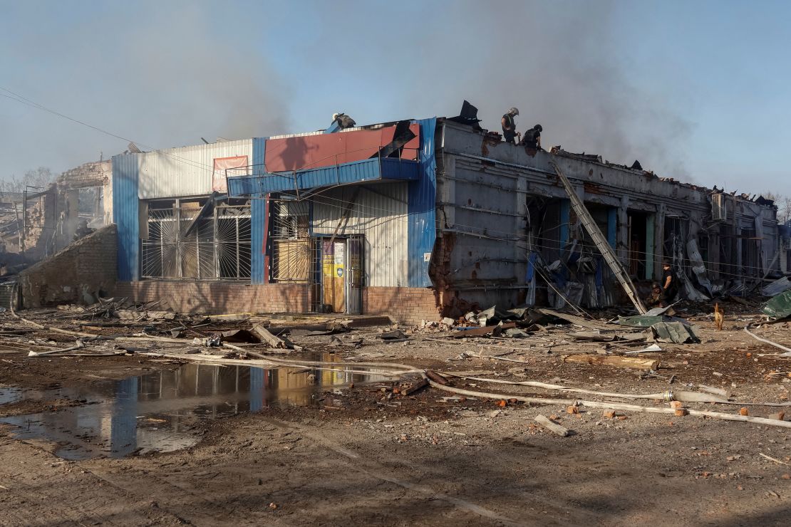 Rescuers work at the site of Russian airstrikes in the village of Lyptsi, in the Kharkiv region of Ukraine, on April 10, 2024.