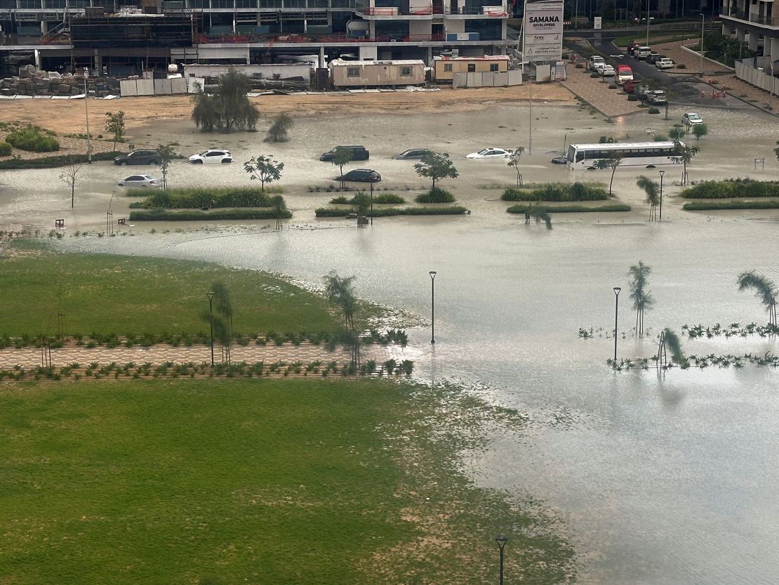Cars drive on a flooded street in Dubai, United Arab Emirates, on Tuesday.