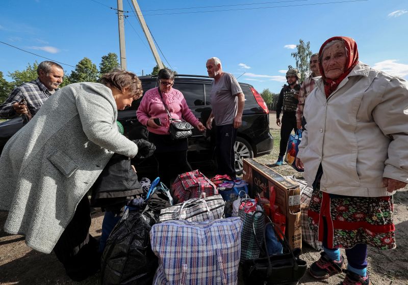 Residents from Vovchansk and nearby villages wait for buses amid an evacuation to Kharkiv on Friday.