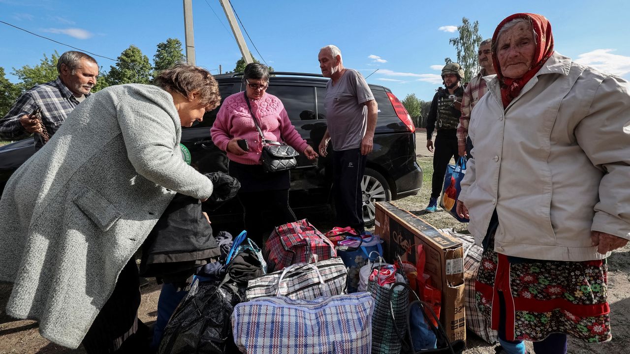 Residents from Vovchansk and nearby villages wait for buses amid an evacuation to Kharkiv on Friday.