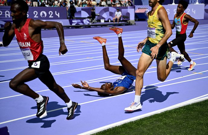 US runner Abdihamid Nur falls during a preliminary heat for the 5,000 meters on August 7.