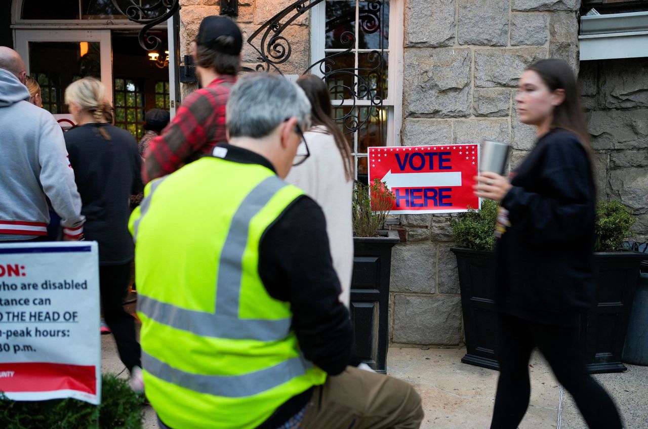 People wait to vote in Atlanta on Tuesday.