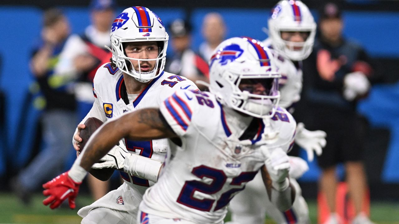 Dec 15, 2024; Detroit, Michigan, USA; Buffalo Bills quarterback Josh Allen (17) rolls out of the pocket before throwing a touchdown pass against the Detroit Lions in the fourth quarter at Ford Field. Mandatory Credit: Lon Horwedel-Imagn Images