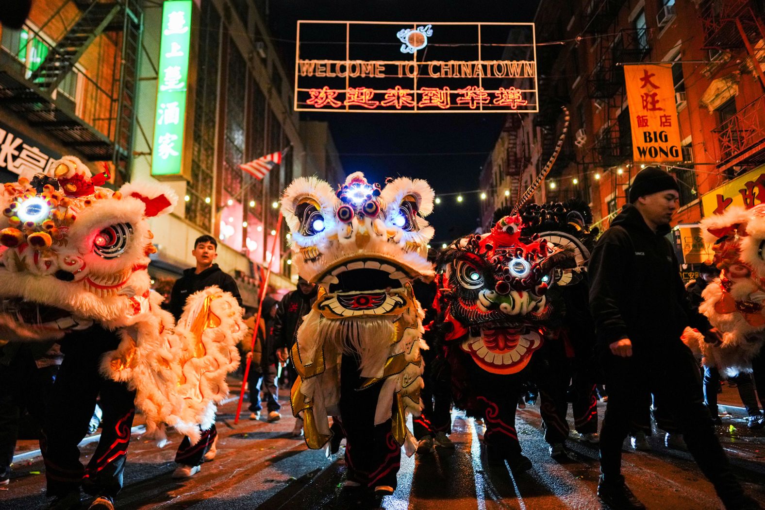 Dancers wearing lion costumes perform during a midnight Lunar New Year celebration, marking the Year of the Snake, in New York City's Chinatown, on Wednesday.