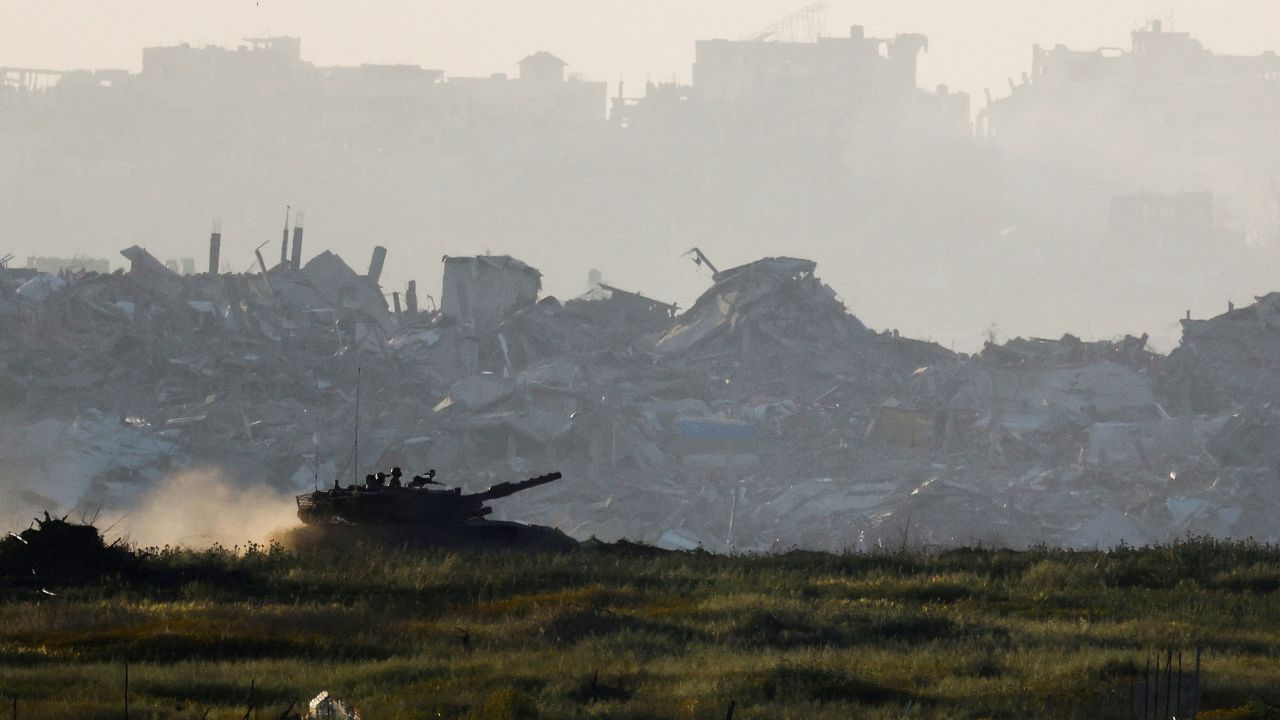 FILE PHOTO: A tank manoeuvres inside Gaza, as seen from Israel's border with Gaza, Israel March 19, 2025. REUTERS/Amir Cohen/File Photo     TPX IMAGES OF THE DAY/