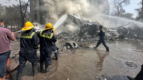 Rescue team members work as smoke rises at the site where an Air India plane crashed in Ahmedabad, India, June 12, 2025. REUTERS/Amit Dave TPX IMAGES OF THE DAY