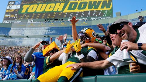 Sep 7, 2025; Green Bay, Wisconsin, USA; Green Bay Packers wide receiver Jayden Reed (11) celebrates with fans after scoring a touchdown against the Detroit Lions during the second quarter at Lambeau Field. Mandatory Credit: Jeff Hanisch-Imagn Images     TPX IMAGES OF THE DAY     