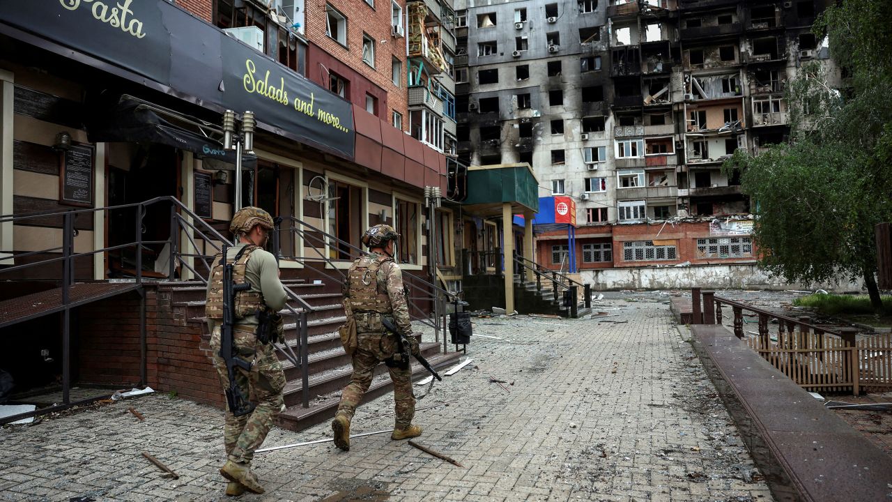 FILE PHOTO: Members of the White Angel unit of Ukrainian police officers who evacuate people from the frontline towns and villages, check an area for residents, amid Russia's attack on Ukraine, in the frontline town of Pokrovsk in Donetsk region, Ukraine May 21, 2025. REUTERS/Anatolii Stepanov/File Photo