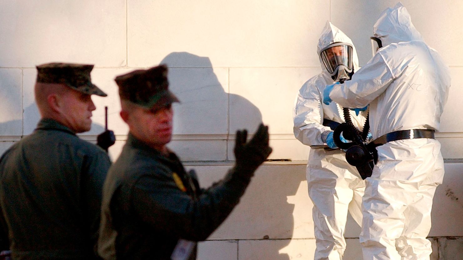 U.S. Marines and workers in protective suits prepare to enter the closed Russell Senate Office Building on Capitol Hill on Feb. 4, 2004.