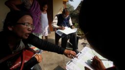 A census official collects information from a household in Bonda, on the outskirts of Gauhati, India, during the 2011 national census.