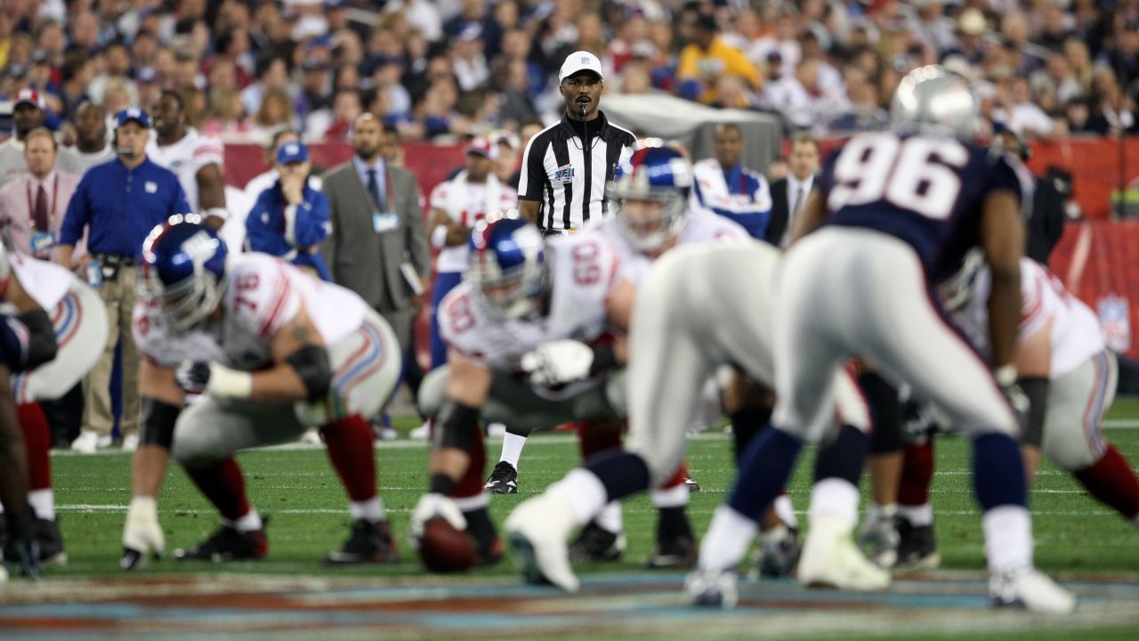 NFL referee Mike Carey (94) is seen during the Super Bowl XLII football game between the New England Patriots and New York Giants on Sunday, Feb. 3, 2008 in Glendale, Ariz. (Ben Liebenberg via AP)