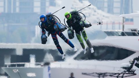 In what's being billed as the world's first-ever jet suit race, two of the competing eight pilots fly along a route against a backdrop of skyscrapers and luxury yachts in Dubai on February 28.