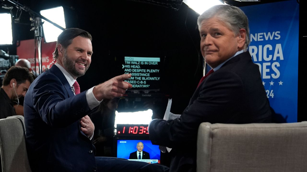 Vance speaks to Sean Hannity on the Fox News Channel in the spin room after a CBS News vice presidential debate on Tuesday in New York.