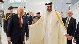 Qatar's Emir Sheikh Tamim bin Hamad Al Thani welcomes President Donald Trump during an official welcoming ceremony at the Amiri Diwan in Doha, Qatar, Wednesday, May 14, 2025. (AP Photo/Alex Brandon)