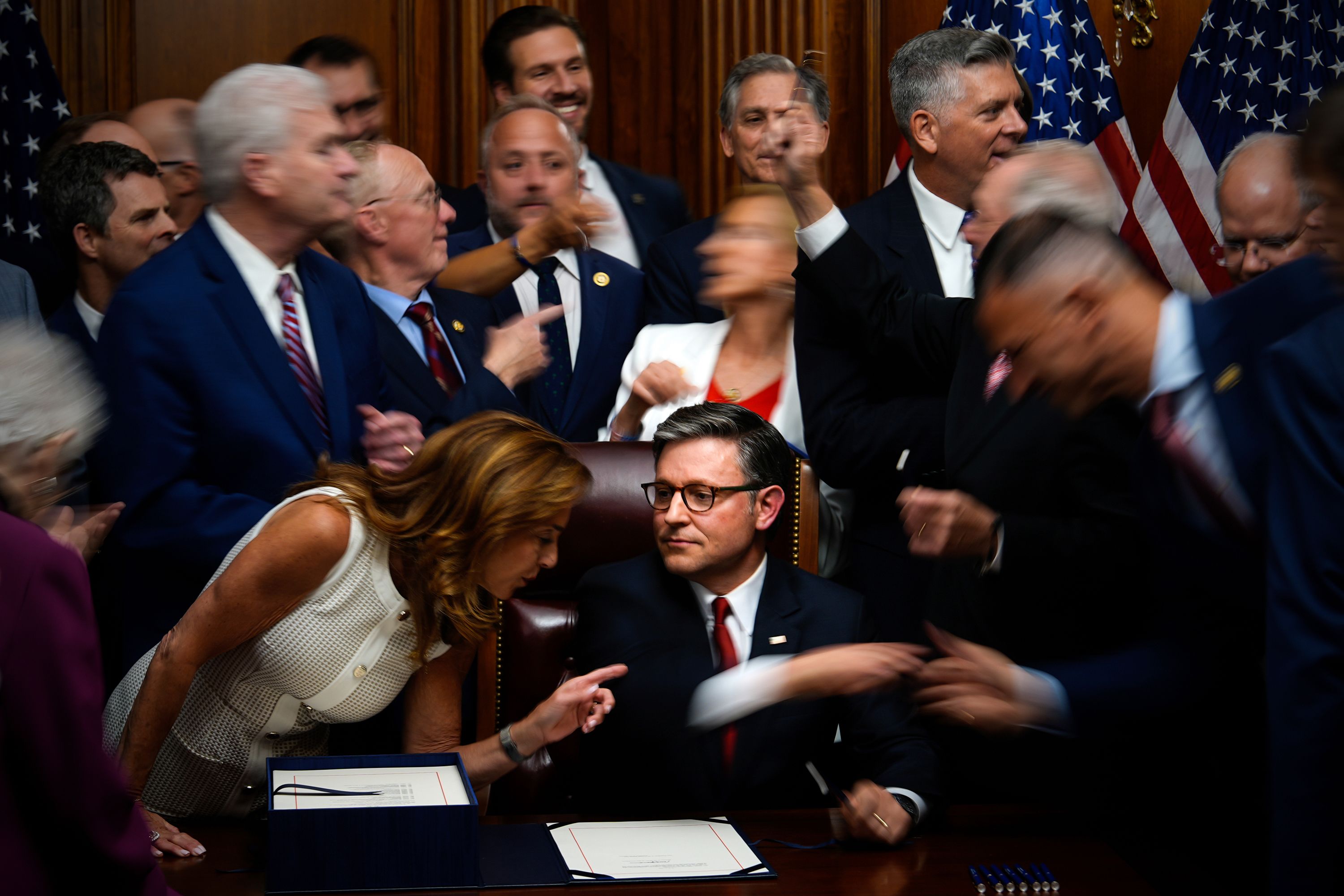 Republican members of Congress gather around House Speaker Mike Johnson after he signed President Donald Trump's signature domestic policy bill in Washington, DC, on Thursday, July 3.