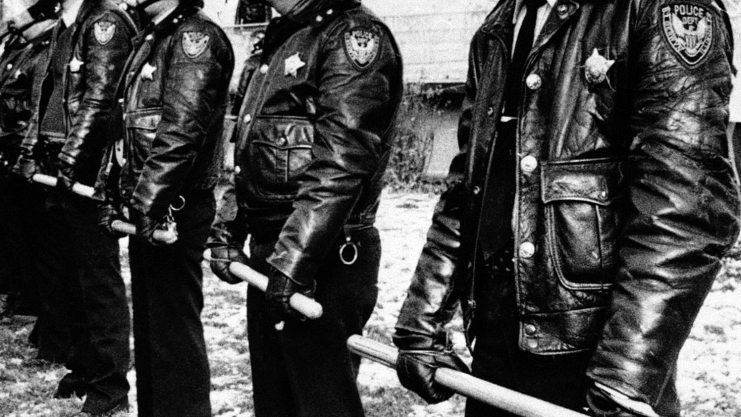 Riot police stand to face people protesting a Nazi rally in the Berwyn suburb of Chicago in November 1981.