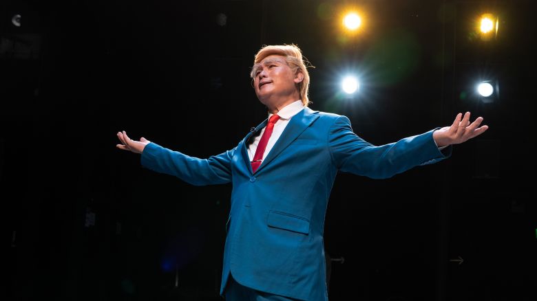 Cantonese opera actor Loong Koon-tin, portraying U.S. President Donald Trump, poses for photos on stage after a performance of ‘Trump, the Twin Presidents’ at the Xiqu Centre in Hong Kong, China, on Friday, June 6, 2025.