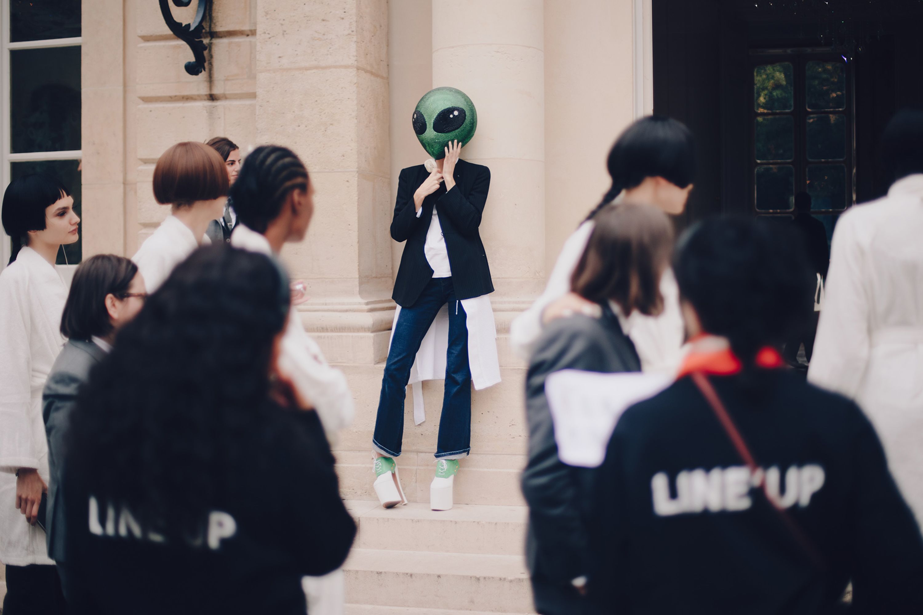 An off-duty alien at Thom Browne's Spring-Summer 2026 show during Paris Fashion Week.