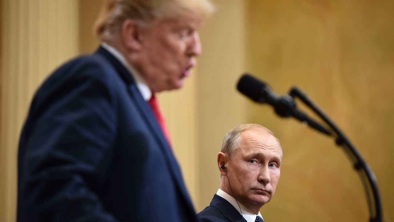 US President Donald Trump (L) and Russia's President Vladimir Putin attend a joint press conference after a meeting at the Presidential Palace in Helsinki, on July 16, 2018. - The US and Russian leaders opened an historic summit in Helsinki, with Donald Trump promising an "extraordinary relationship" and Vladimir Putin saying it was high time to thrash out disputes around the world. (Photo by Brendan SMIALOWSKI / AFP)        (Photo credit should read BRENDAN SMIALOWSKI/AFP via Getty Images)