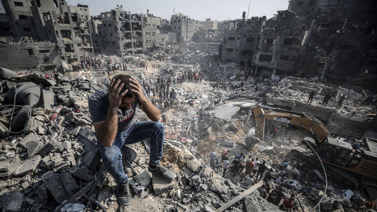 Palestinians conduct a search and rescue operation after bombardment by the Israeli army at Jabalia refugee camp in Gaza on November 1.