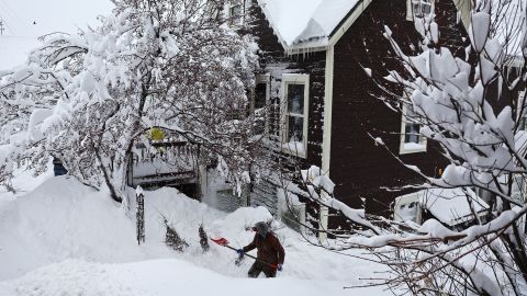 TRUCKEE, CALIFORNIA - MARCH 02: A worker digs out snow from a home north of Lake Tahoe during a powerful multiple day winter storm in the Sierra Nevada mountains on March 02, 2024 in Truckee, California. Blizzard warnings were issued with snowfall of up to 12 feet and wind gusts over 100 mph expected in some higher elevation locations. Yosemite National Park is closed and a 50-mile stretch of Interstate 80 was shut down yesterday due to the storm. (Photo by Mario Tama/Getty Images)