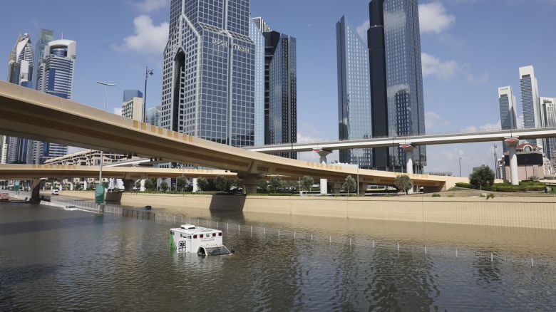 An abandoned ambulance submerged in flood water on a highway after a rainstorm in Dubai, United Arab Emirates, on Wednesday, April 17, 2024. The United Arab Emirates experienced its heaviest downpour since records began in 1949, Dubai's media office said in a statement. Photographer: Christopher Pike/Bloomberg via Getty Images