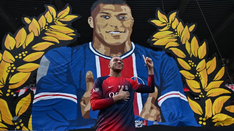 PARIS, FRANCE - MAY 12: Kylian Mbappe of Paris Saint-Germain stands in front of a poster with his likeness prior the Ligue 1 Uber Eats match between Paris Saint-Germain and Toulouse FC at Parc des Princes on May 12, 2024 in Paris, France.(Photo by Sebastian Frej/MB Media/Getty Images)