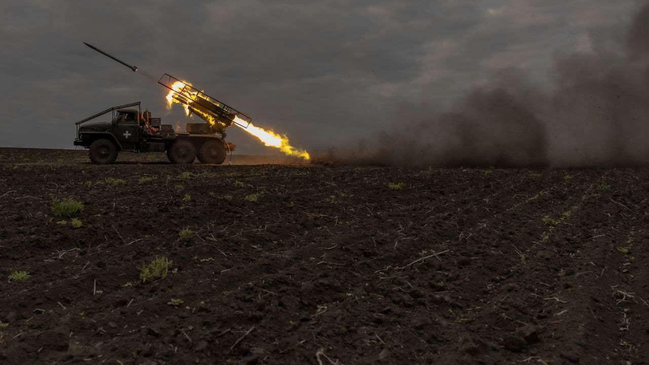 Ukrainian servicemen of the 92nd Assault Brigade fire BM-21 'Grad' multiple rocket launcher toward Russian positions, in the Kharkiv region, on May 15, 2024, amid the Russian invasion of Ukraine. President Volodymyr Zelensky cancelled planned trips abroad over the fresh offensive and the military was sending more troops to Kharkiv to hold back Russian advances, Kyiv said. (Photo by Roman PILIPEY / AFP)